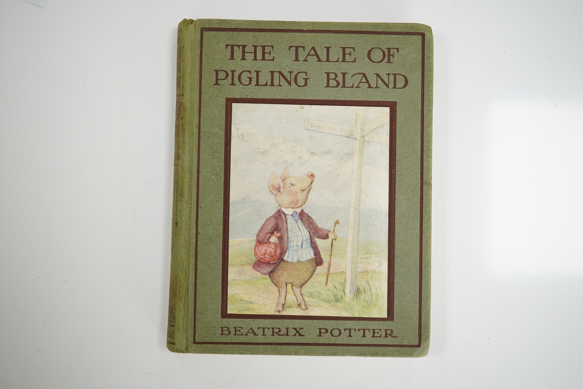 Potter, Beatrix - The Tale of Pigling Bland. First Edition. title illus., frontis., 14 coloured and other text illus., pictorial coloured e/ps.; light green paper boards lettered in brown, with mounted coloured illus. on